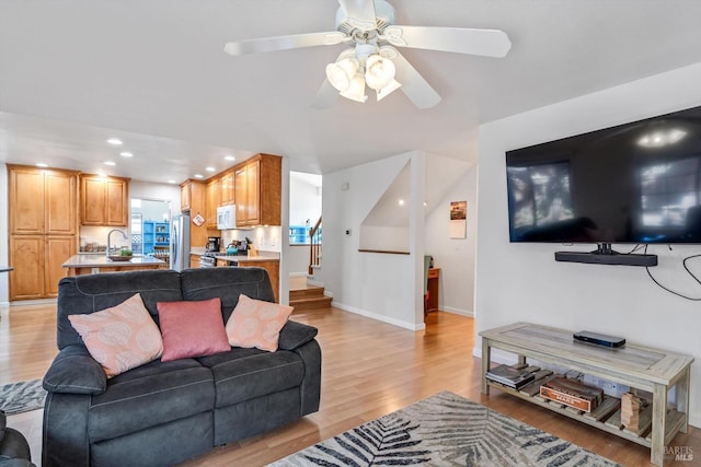 7350 Rasmussen Way, Rohnert Park, CA 94928 - living room featuring stairs, ceiling fan, light wood finished floors, baseboards, and recessed lighting
