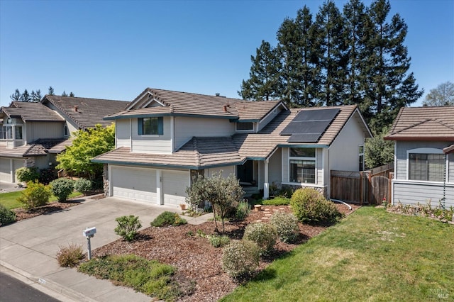 7350 Rasmussen Way, Rohnert Park, CA 94928 - traditional home with a tiled roof, solar panels, concrete driveway, fence, and a garage