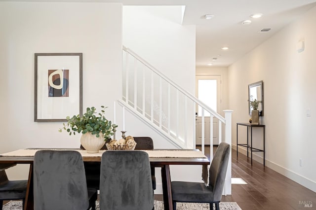 dining area featuring dark wood-style flooring, baseboards, visible vents, recessed lighting, and stairway