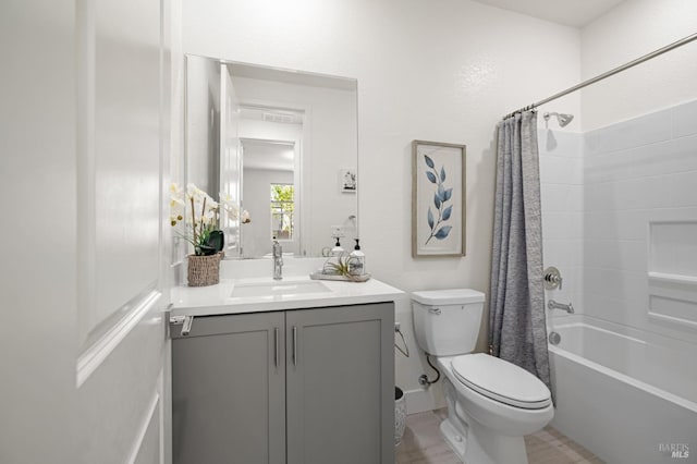 full bathroom with toilet, vanity, and shower / bath combo with shower curtain