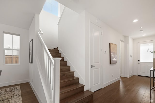 entrance foyer with stairway, a healthy amount of sunlight, wood-type flooring, baseboards, and recessed lighting