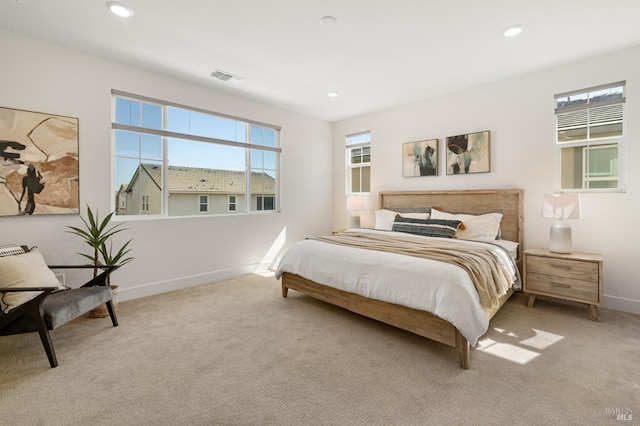 bedroom with light colored carpet, baseboards, visible vents, and recessed lighting