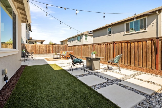 view of yard featuring a patio area and a fenced backyard