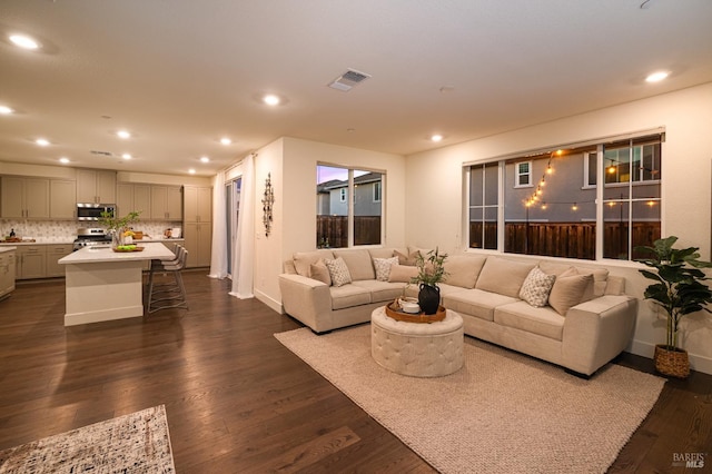 2428 Periwinkle Pl, Fairfield, CA 94533 - living room featuring dark wood-style floors, recessed lighting, and baseboards