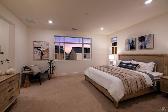 carpeted bedroom with baseboards, visible vents, and recessed lighting