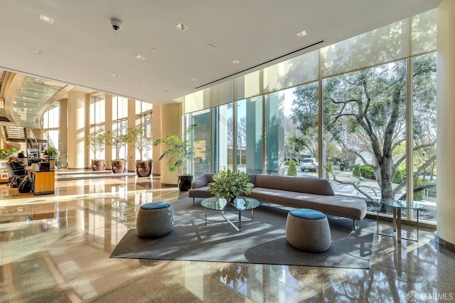 community lobby featuring floor to ceiling windows and a high ceiling