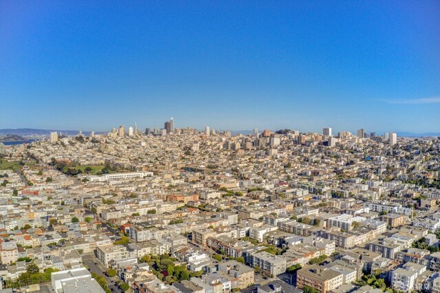 aerial view of property's location featuring nearby urban area