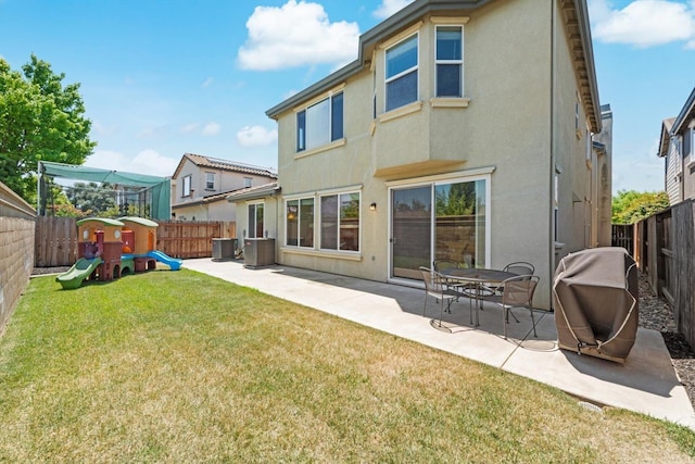 2468 Goehring Dr, Lodi, CA 95242 - back of house featuring a lawn, a fenced backyard, a patio area, and stucco siding