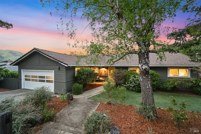 15 Manor View Dr, Fairfax, CA 94930 - ranch-style home featuring concrete driveway, a garage, a tiled roof, and a lawn