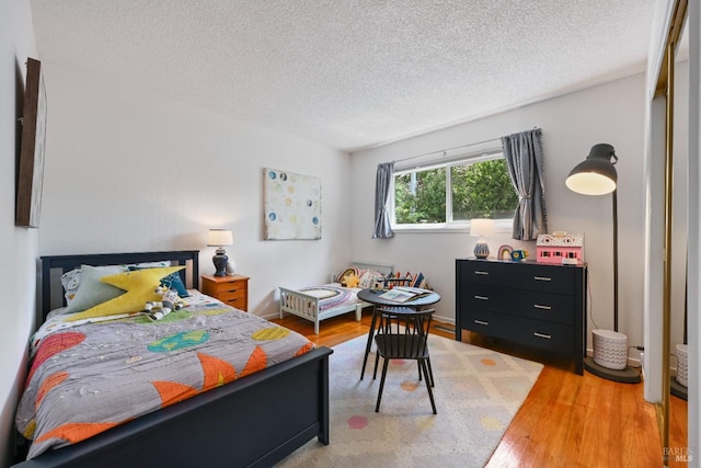 15 Manor View Dr, Fairfax, CA 94930 - bedroom featuring light wood-style floors and a textured ceiling
