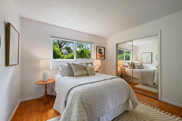 15 Manor View Dr, Fairfax, CA 94930 - bedroom featuring a closet, wood finished floors, and a textured ceiling