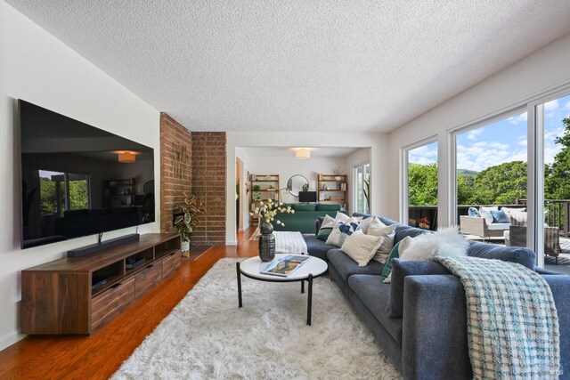 15 Manor View Dr, Fairfax, CA 94930 - living area with a textured ceiling, wood finished floors, and healthy amount of natural light