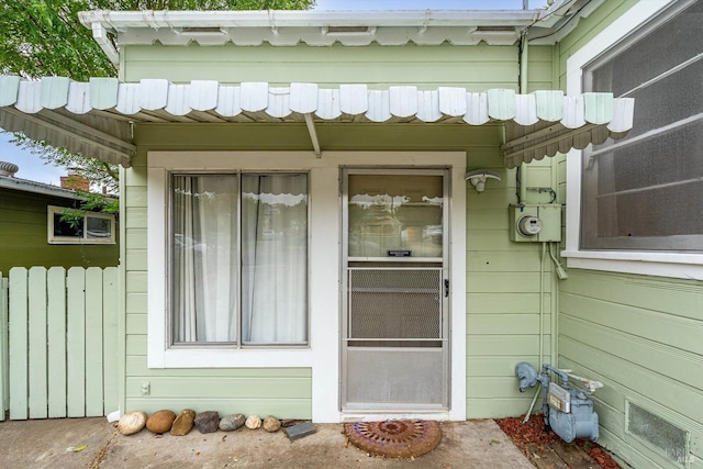 view of exterior entry with radiator heating unit