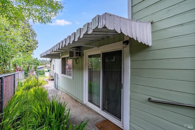 view of side of home with fence