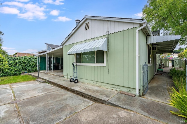 back of house with a patio area and fence