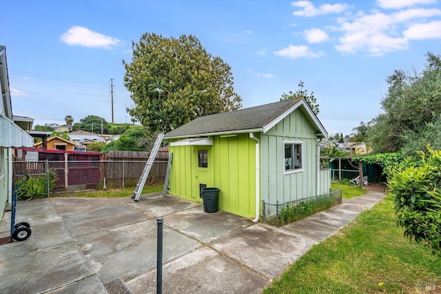 view of shed with a fenced backyard