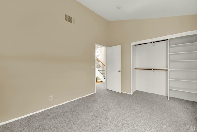 515 Paula Dr, Suisun City, CA 94585 - unfurnished bedroom with carpet flooring, a closet, baseboards, and vaulted ceiling