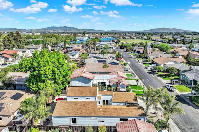 drone / aerial view featuring a mountain view and a residential view