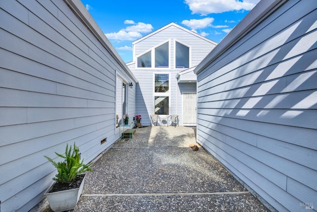 view of property exterior featuring a patio area