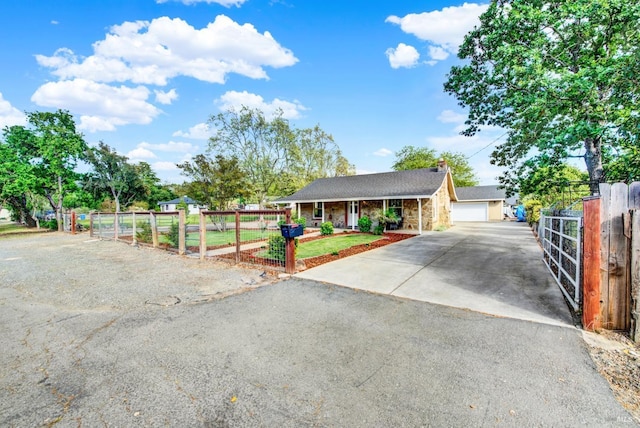 view of front of property featuring a chimney, fence, a garage, and covered porch