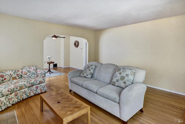 1467 Ohio St, Vallejo, CA 94590 - living room featuring arched walkways, ceiling fan, wood finished floors, and baseboards