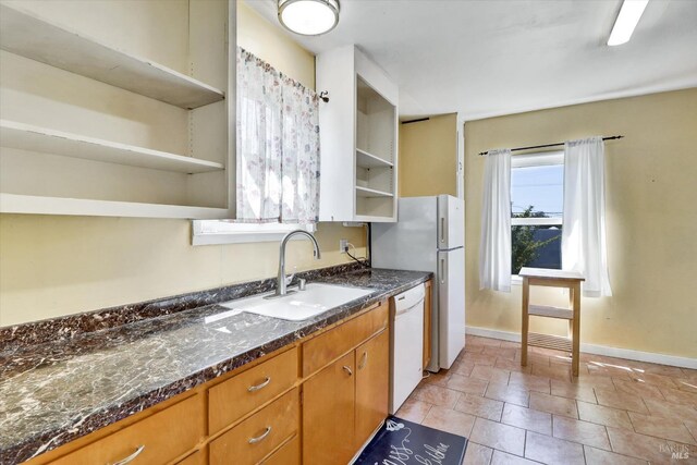 1467 Ohio St, Vallejo, CA 94590 - kitchen featuring open shelves, a sink, white appliances, baseboards, and brown cabinetry