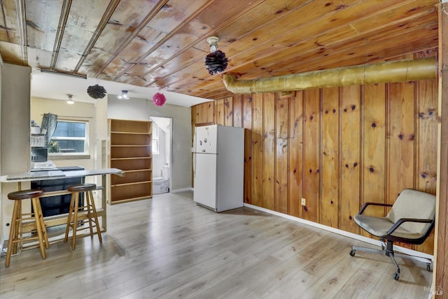1467 Ohio St, Vallejo, CA 94590 - kitchen with freestanding refrigerator, wooden walls, light wood-style floors, wood ceiling, and a desk