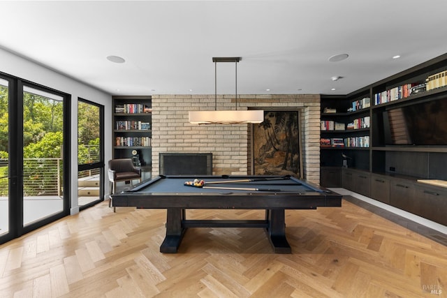 rec room with recessed lighting, a fireplace, built in shelves, and billiards