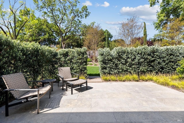 view of patio / terrace featuring fence