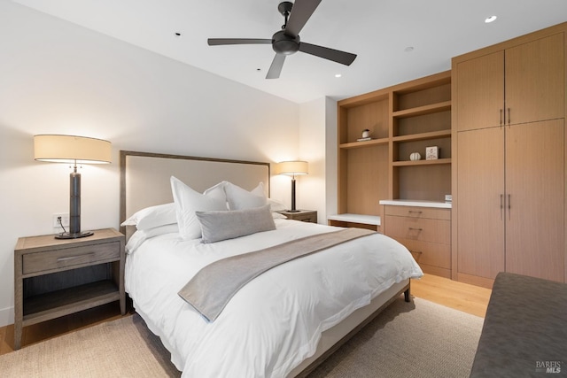 bedroom with recessed lighting, light wood-style floors, and a ceiling fan