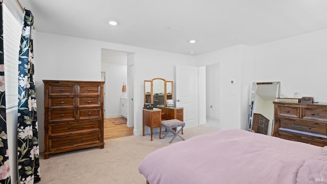 bedroom featuring light colored carpet, baseboards, and recessed lighting