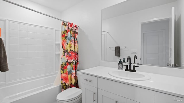 full bath featuring shower / bath combo with shower curtain, vanity, and toilet