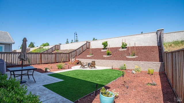 view of yard featuring a fenced backyard and a patio