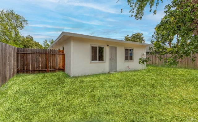view of outbuilding featuring a fenced backyard