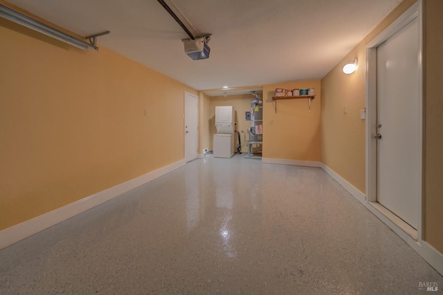 garage with baseboards and a garage door opener