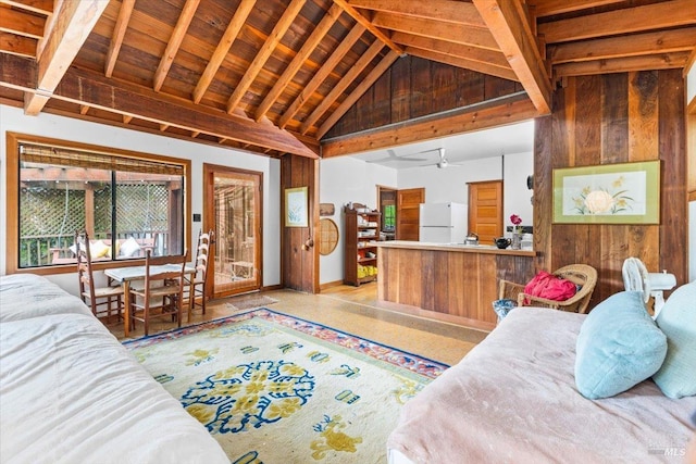 2426 S Fitch Mountain Rd, Healdsburg, CA 95448 - bedroom with high vaulted ceiling, freestanding refrigerator, wood walls, and baseboards