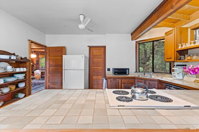 2426 S Fitch Mountain Rd, Healdsburg, CA 95448 - kitchen with a sink, freestanding refrigerator, a ceiling fan, open shelves, and tile countertops