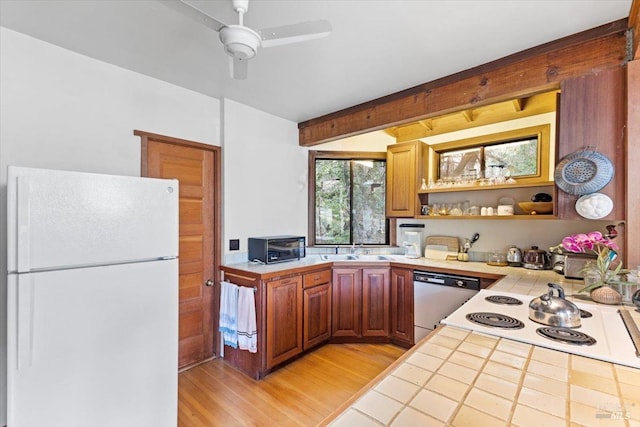 2426 S Fitch Mountain Rd, Healdsburg, CA 95448 - kitchen with a ceiling fan, tile counters, a sink, white appliances, and light wood finished floors