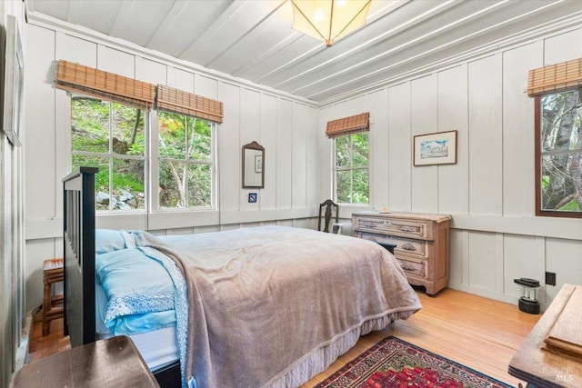 2426 S Fitch Mountain Rd, Healdsburg, CA 95448 - bedroom featuring wood finished floors and a decorative wall