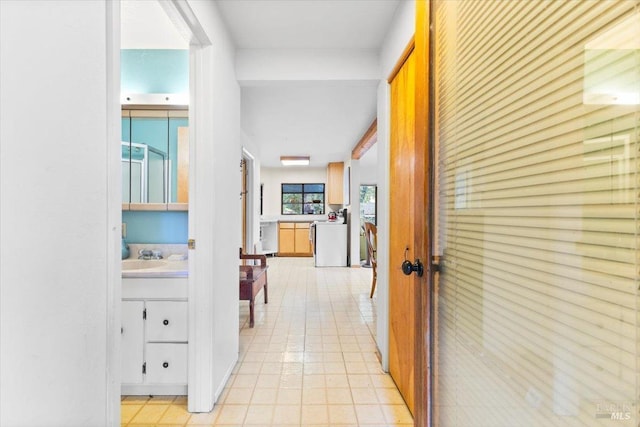 2426 S Fitch Mountain Rd, Healdsburg, CA 95448 - hallway featuring washer / clothes dryer and light tile patterned floors