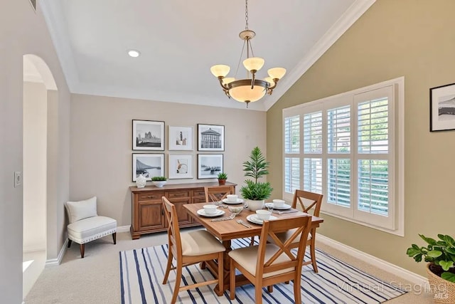 581 Werner Way, Vacaville, CA 95688 - dining area with arched walkways, vaulted ceiling, a chandelier, baseboards, and light colored carpet