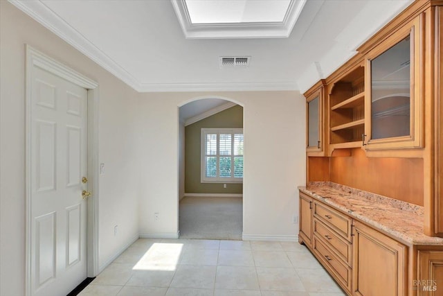 581 Werner Way, Vacaville, CA 95688 - bar with arched walkways, ornamental molding, light carpet, baseboards, and light tile patterned floors