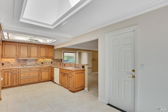 581 Werner Way, Vacaville, CA 95688 - kitchen with white dishwasher, a peninsula, a skylight, decorative backsplash, and light stone counters
