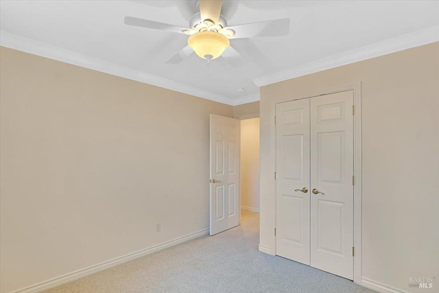 581 Werner Way, Vacaville, CA 95688 - unfurnished bedroom with light colored carpet, a closet, crown molding, baseboards, and a ceiling fan