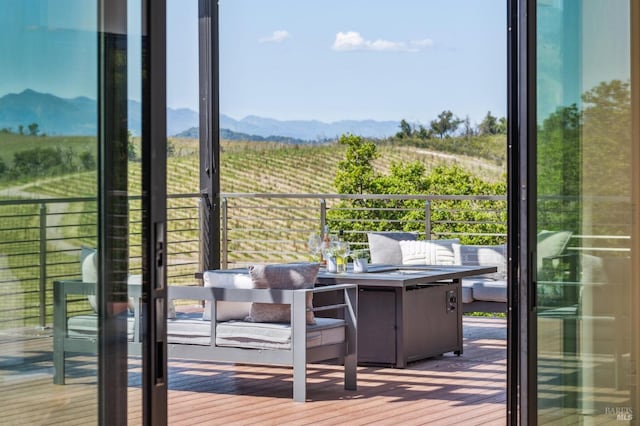 entryway featuring a mountain view, wood finished floors, and a rural view