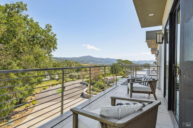 balcony featuring a mountain view