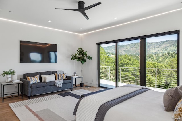 bedroom featuring recessed lighting, a ceiling fan, and wood finished floors