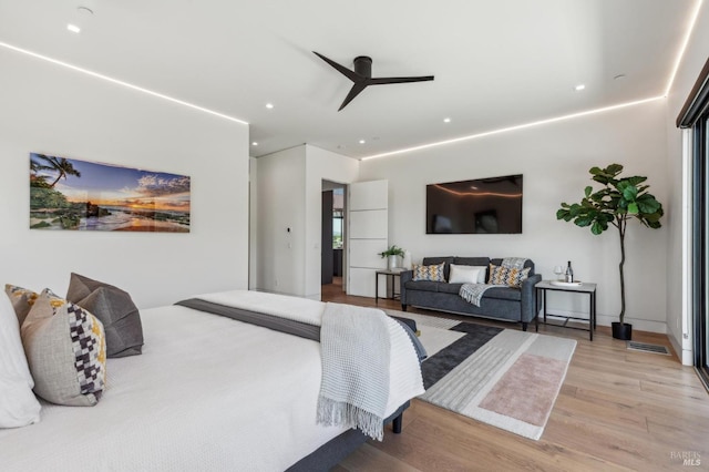 bedroom featuring recessed lighting, a ceiling fan, visible vents, and wood finished floors