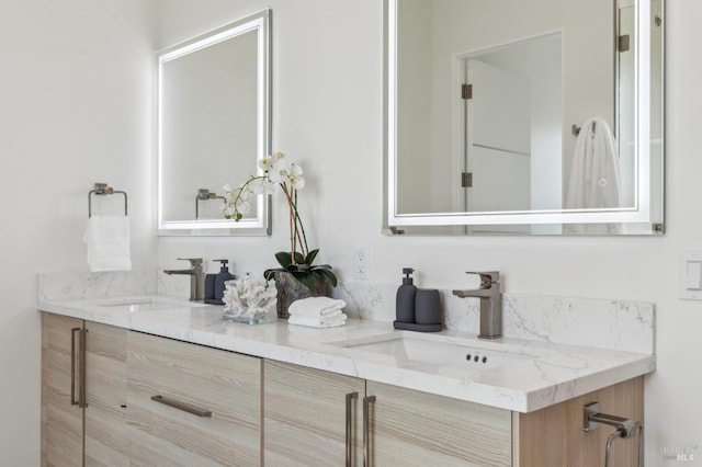 bathroom with double vanity and a sink