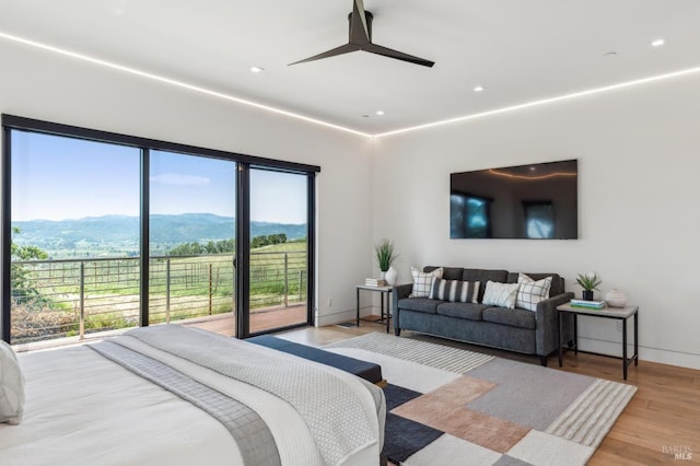 bedroom featuring baseboards, recessed lighting, access to outside, a ceiling fan, and light wood-style flooring